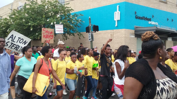 group of protesters marching in baton rouge, louisiana