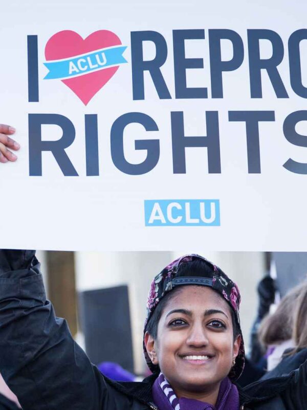 woman holding sign reading i heart repro rights