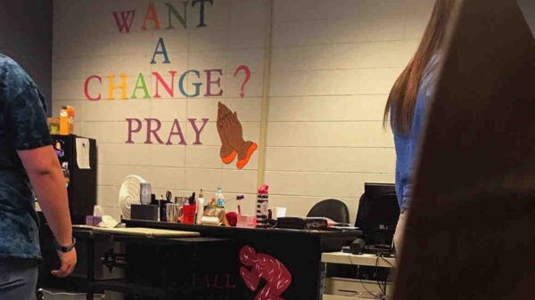 Sign reading "Want a change? Pray"