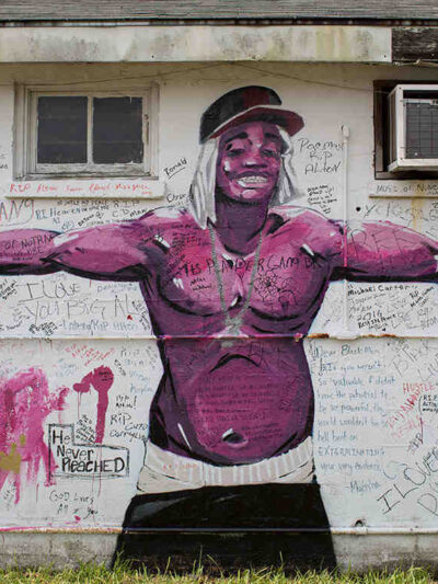 Painted memorial of Alton Sterling on the side of a building