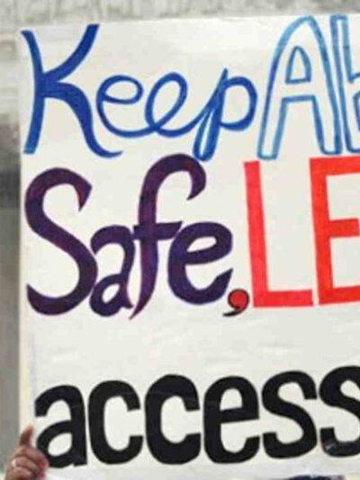 Protest sign reading "Keep abortion safe, legal and accessible"