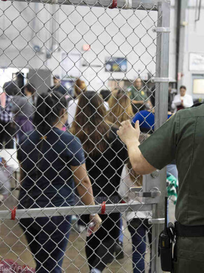 Image of immigrants in a detention facility