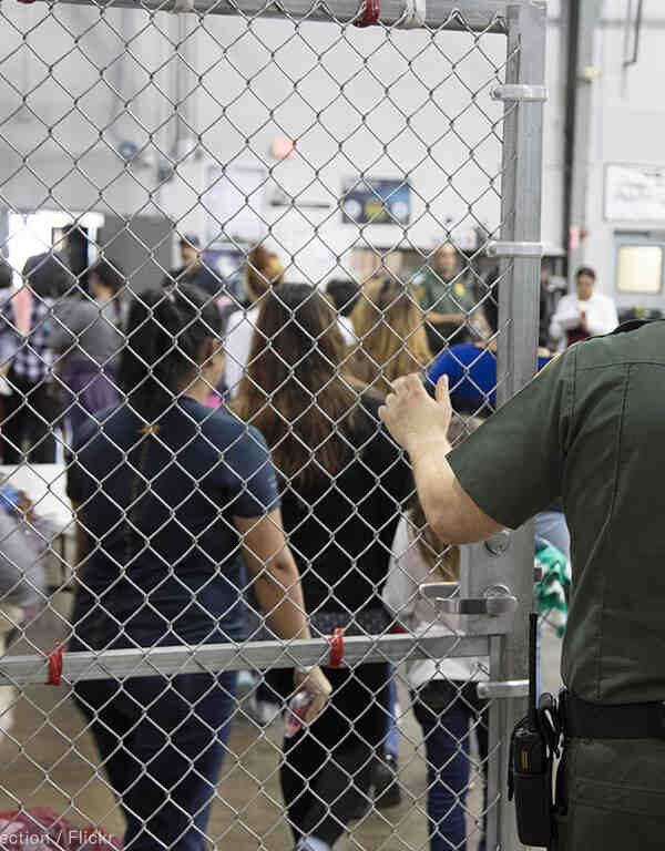 Image of immigrants in a detention facility