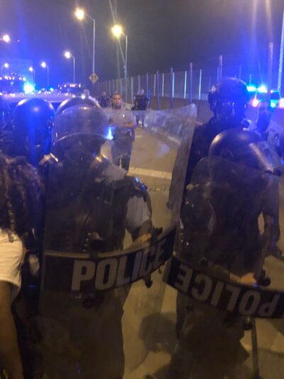 Protesters and police clashing at the CCC bridge in New Orleans