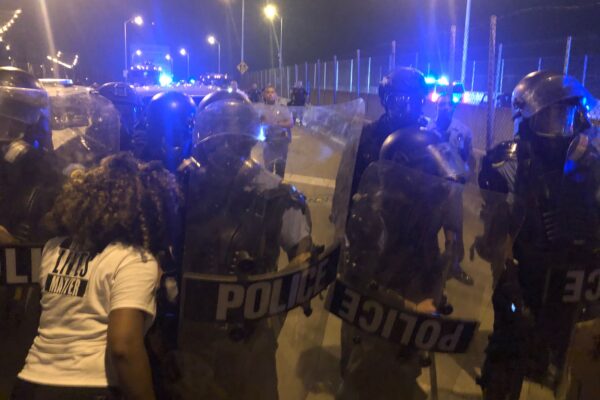 Protesters and police clashing at the CCC bridge in New Orleans