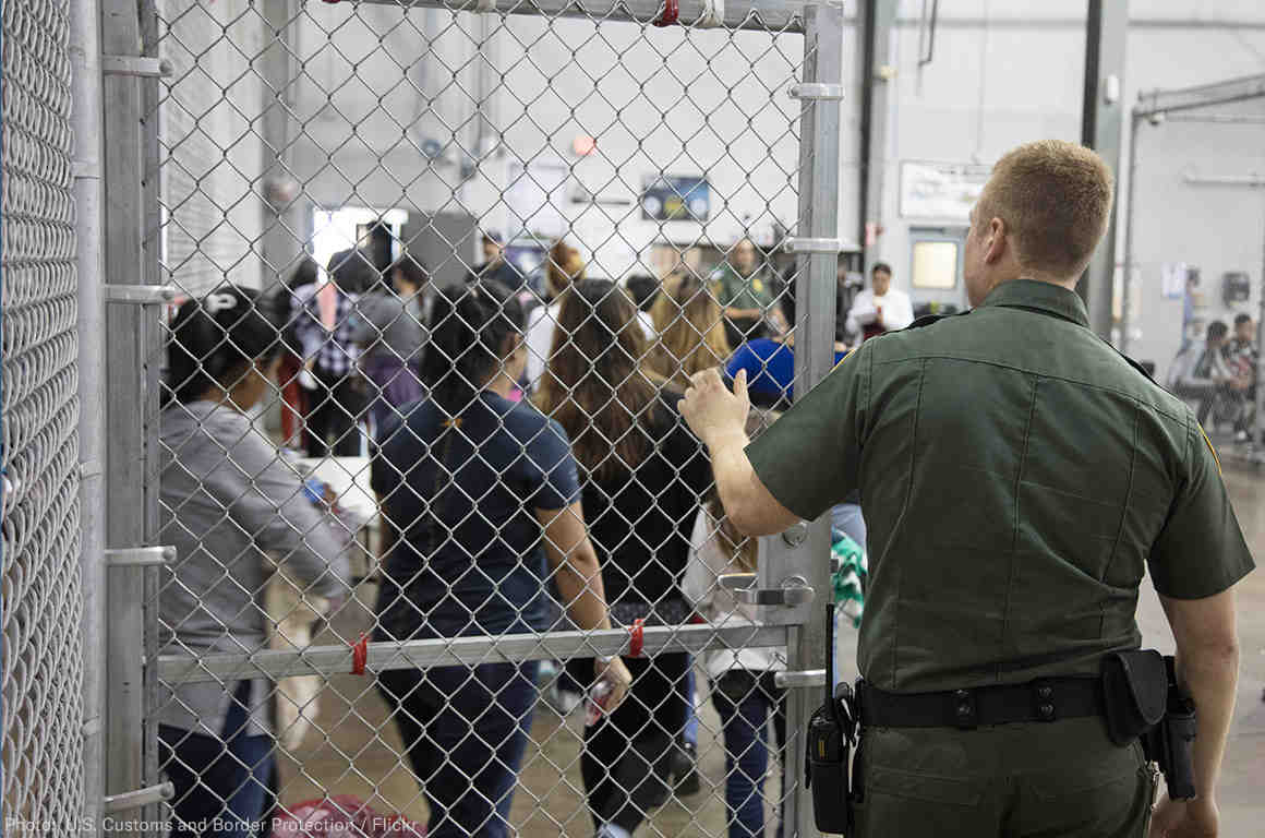 Image of immigrants in a detention facility