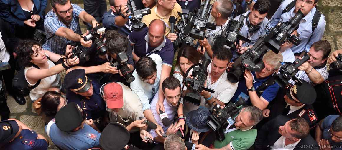 overhead shot of group of reporters 