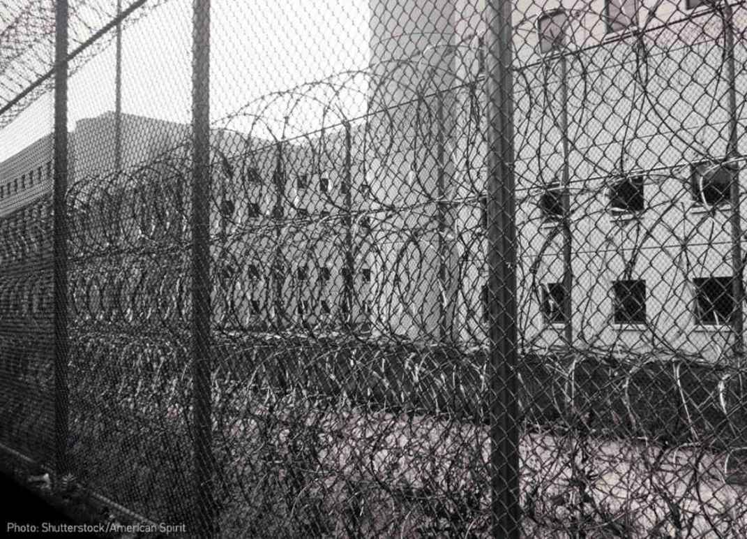 Razor wire and fence outside jail 