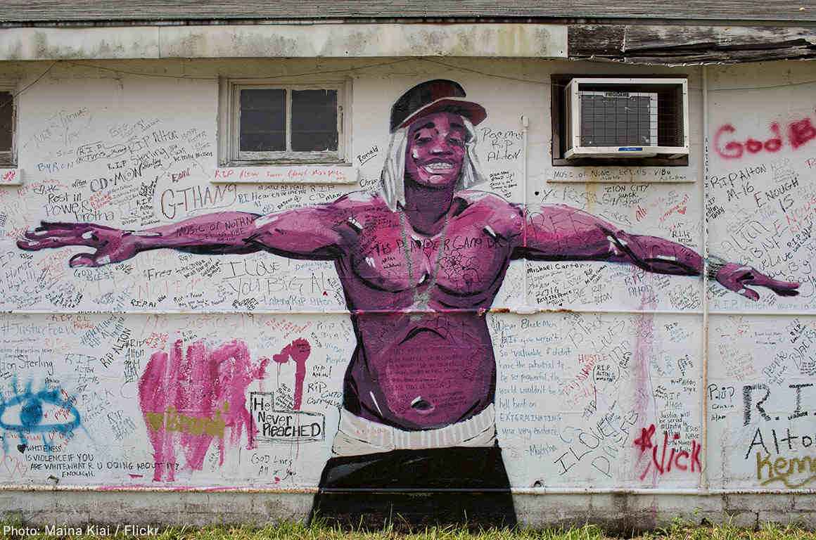 Painted memorial of Alton Sterling on the side of a building