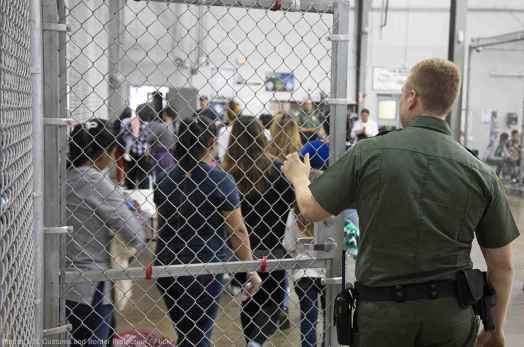 Image of immigrants in a detention facility 