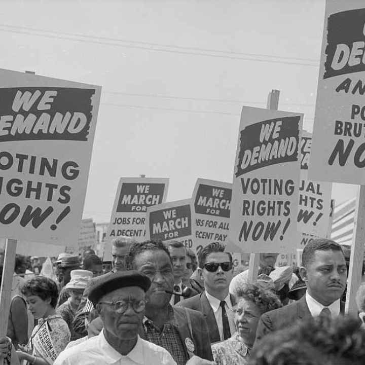 Voting Rights advocates hold signs at The March on Washington, 1963