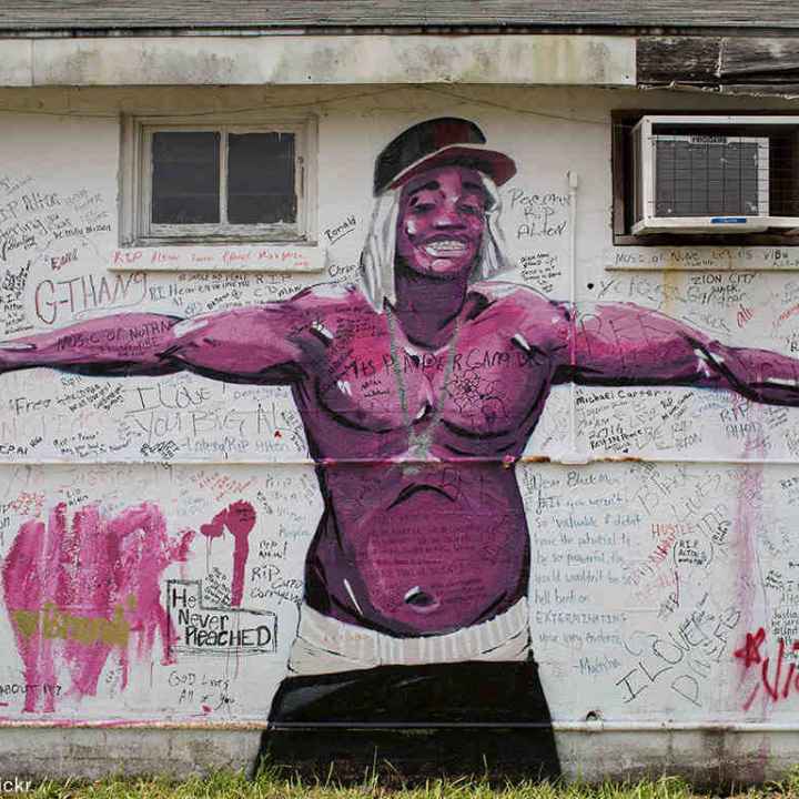 Painted memorial of Alton Sterling on the side of a building